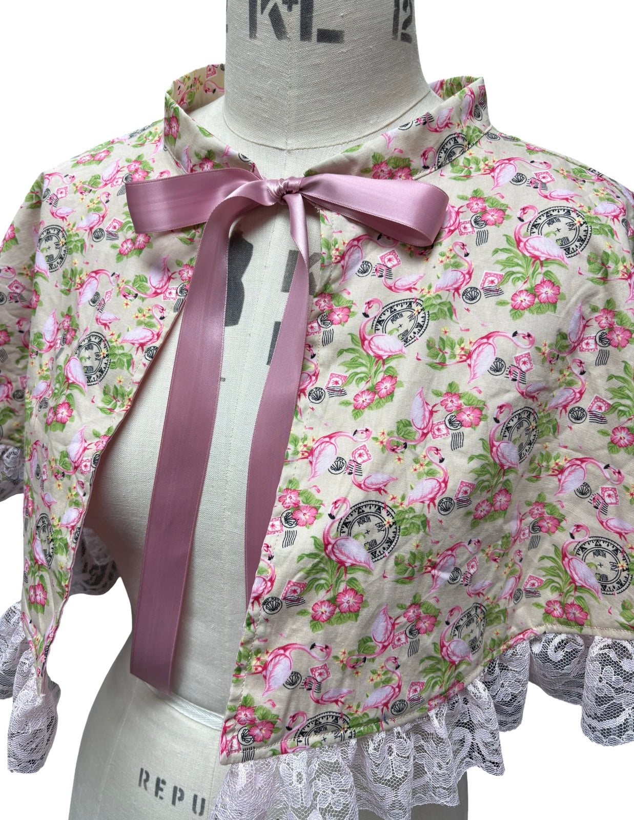 “Miriam” Capelet with lace in flamingo postcard print